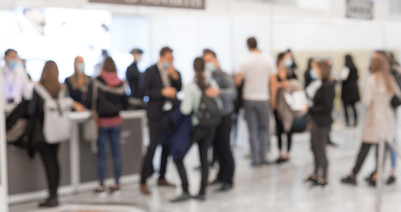 Blurred image of people at an Expo